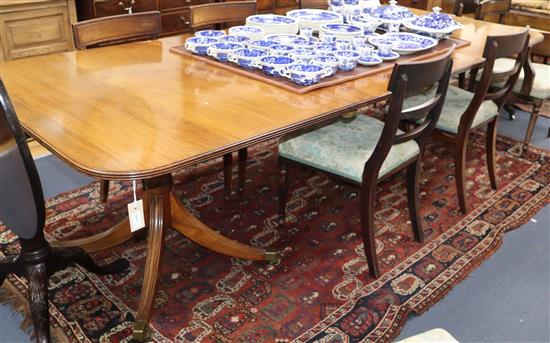 A William Tillman George III style two-pillar dining table having two additional leaves L 253cm